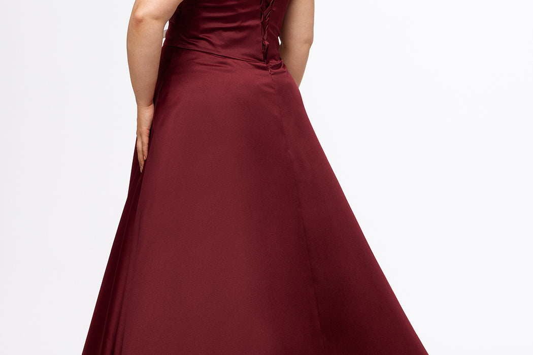 Plus Size Prom & Formal dress by Sydney's Closet - Style SC7431 shown in Burgundy Red. 

A-line silhouette, sweetheart neckline with pleated bust and knot details, detachable off the shoulder straps, natural waistline, A-line skirt with pocket and sexy slit with founce ruffle detail. 
