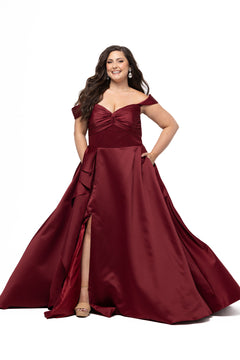 Plus Size Prom & Formal dress by Sydney's Closet - Style SC7431 shown in Burgundy Red. 

A-line silhouette, sweetheart neckline with pleated bust and knot details, detachable off the shoulder straps, natural waistline, A-line skirt with pocket and sexy slit with founce ruffle detail. 