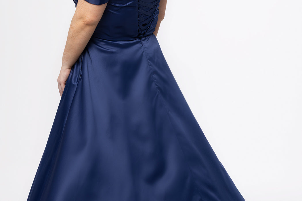 Plus Size Prom & Formal dress by Sydney's Closet - Style SC7431 shown in Navy. 

A-line silhouette, sweetheart neckline with pleated bust and knot details, detachable off the shoulder straps, natural waistline, A-line skirt with pocket and sexy slit with founce ruffle detail. 