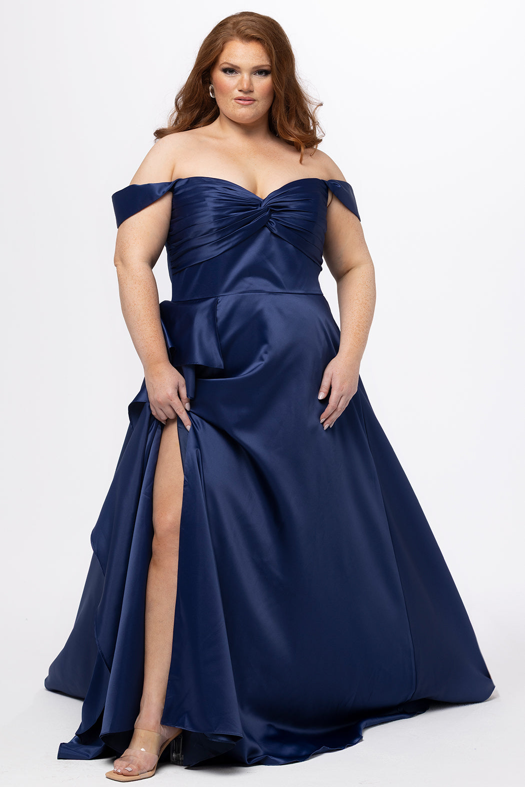 Plus Size Prom & Formal dress by Sydney's Closet - Style SC7431 shown in Navy. 

A-line silhouette, sweetheart neckline with pleated bust and knot details, detachable off the shoulder straps, natural waistline, A-line skirt with pocket and sexy slit with founce ruffle detail. 
