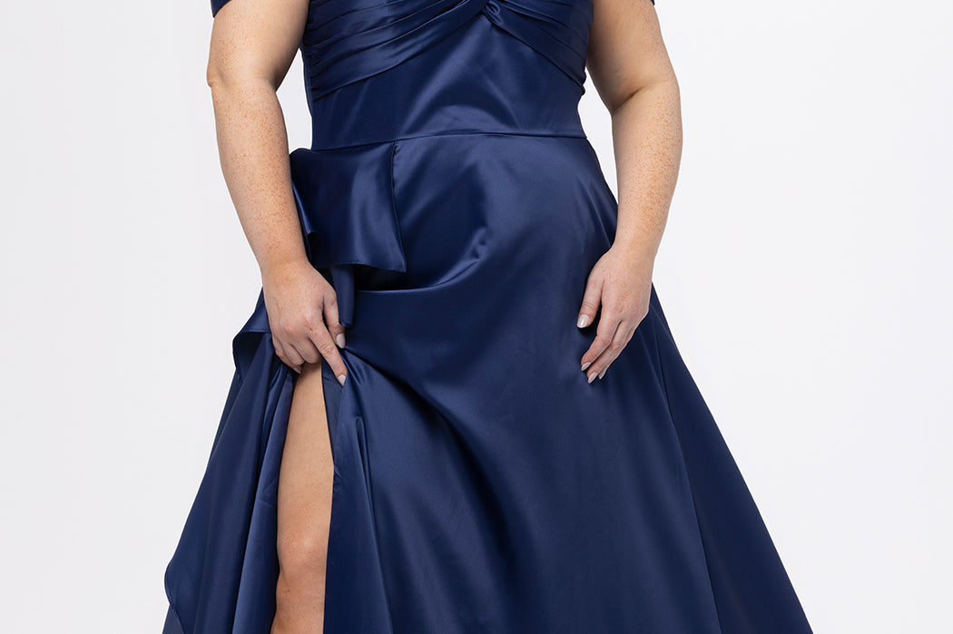 Plus Size Prom & Formal dress by Sydney's Closet - Style SC7431 shown in Navy. 

A-line silhouette, sweetheart neckline with pleated bust and knot details, detachable off the shoulder straps, natural waistline, A-line skirt with pocket and sexy slit with founce ruffle detail. 