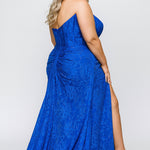 Plus size lace slim fitted dress featuring stretch lace with tone-on-tone hot fix stones.  Cateye bodice, exposed corset boning, assymetrical waistline with detachable drape scarf, ruched skirt with high slit and sweep train.  Sydney's Closet style SC7432 in Cobalt Blue.