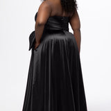 Sydney's Closet style SC7437 in black. 

Plus size A-line formal dress with strapless, pleated bodice, natural waistline with detachable oversized bow, A-line skirt with horsehair hem in silky satin fabric.