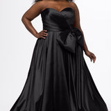 Sydney's Closet style SC7437 in black. 

Plus size A-line formal dress with strapless, pleated bodice, natural waistline with detachable oversized bow, A-line skirt with horsehair hem in silky satin fabric.