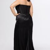 Sydney's Closet style SC7438 in onyx black or onyx black/nude. 

Slim, fitted silhouette with cay eye bodice and hot fix stone detail. Pleated drape over the bust line, exposed corset boning, basque waistline and slim fitted skirt with ruching and slit.  

Choose from tone-on-tone back bodice or color with nude lining on the upper back bodice. 