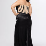 Sydney's Closet style SC7438 in onyx black or onyx black/nude. 

Slim, fitted silhouette with cay eye bodice and hot fix stone detail. Pleated drape over the bust line, exposed corset boning, basque waistline and slim fitted skirt with ruching and slit.  

Choose from tone-on-tone back bodice or color with nude lining on the upper back bodice. 