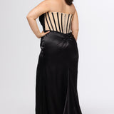 Sydney's Closet style SC7438 in onyx black or onyx black/nude. 

Slim, fitted silhouette with cay eye bodice and hot fix stone detail. Pleated drape over the bust line, exposed corset boning, basque waistline and slim fitted skirt with ruching and slit.  

Choose from tone-on-tone back bodice or color with nude lining on the upper back bodice. 