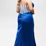 Sydney's Closet style SC7438 in cobalt or cobalt/nude. 

Slim, fitted silhouette with cay eye bodice and hot fix stone detail. Pleated drape over the bust line, exposed corset boning, basque waistline and slim fitted skirt with ruching and slit.  

Choose from tone-on-tone back bodice or color with nude lining on the upper back bodice. 