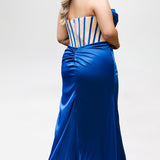 Sydney's Closet style SC7438 in cobalt or cobalt/nude. 

Slim, fitted silhouette with cay eye bodice and hot fix stone detail. Pleated drape over the bust line, exposed corset boning, basque waistline and slim fitted skirt with ruching and slit.  

Choose from tone-on-tone back bodice or color with nude lining on the upper back bodice. 