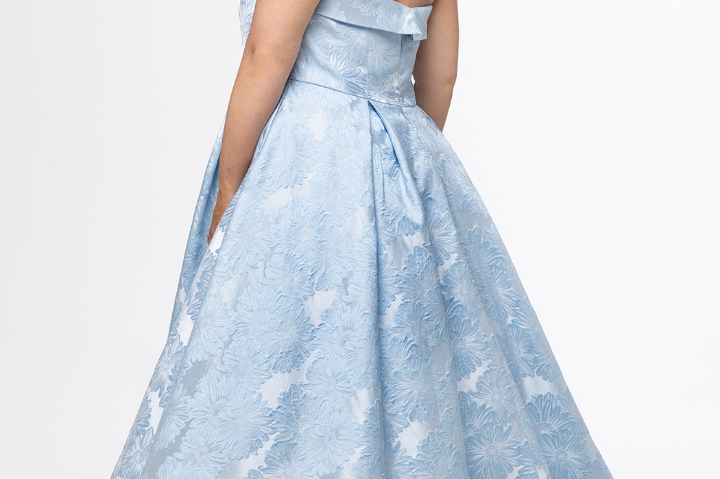 Sydney's Closet style SC7439 in light blue floral brocade.

A-line silhouette, strapless neckline with fold over cuff detail, natural waistline, full a-line skirt with box pleats, crinoline and pockets.
