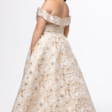 Sydney's Closet SC7440 in gold floral brocade.

Plus size A-line silhouette with off-the-shoulder neckline and fold over cuff on bodice.  Natural waistline with A-line skirt, pockets and left leg slit. 