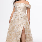 Sydney's Closet SC7440 in gold floral brocade.

Plus size A-line silhouette with off-the-shoulder neckline and fold over cuff on bodice.  Natural waistline with A-line skirt, pockets and left leg slit. 