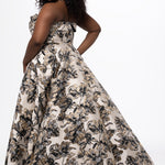 Sydney's Closet style SC7443 in Black/Gold metallic floral brocade.  A-line silhouette, strapless sweetheart neckline with fold over cuff, exposed corset boning on bustier bodice, basque waistline, A-line skirt with pockets and slit.