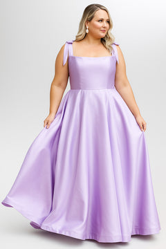 Sydney's Closet style SC7444 in lilac

A-line silhouette, square neckline with wide straps and detachable bows at high point of shoulder. Natural waistline, full A-line skirt with pockets and crinoline. 