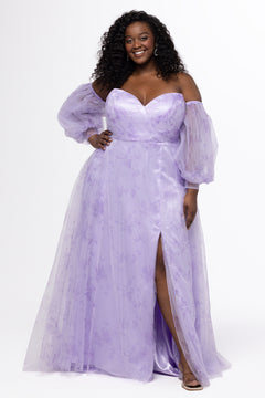 Sydney's Closet style SC7445 in lilac purple floral. 

Plus size A-line strapless formal dress in tulle.  Strapless, pleated, sweetheartneckline, natural waistline, A-line skirt with slit and pockets with detachable puff sleeves.