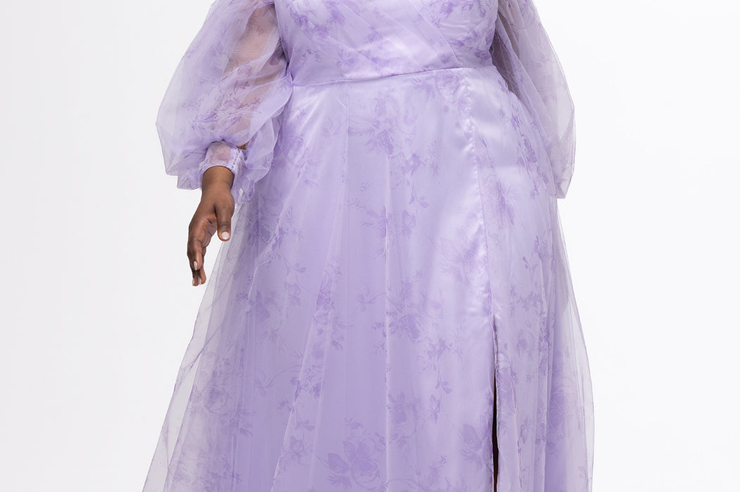 Sydney's Closet style SC7445 in lilac purple floral. 

Plus size A-line strapless formal dress in tulle.  Strapless, pleated, sweetheartneckline, natural waistline, A-line skirt with slit and pockets with detachable puff sleeves.