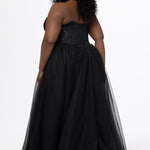 Sydney's Closet style SC7450 in black.

Ball gown silhouette, strapless bodice with deep V-mesh insert covered in lace appliques and exposed corset boning. Basque waistline and full sparkle tulle a-line skirt. Lace up back with modesty panel. 