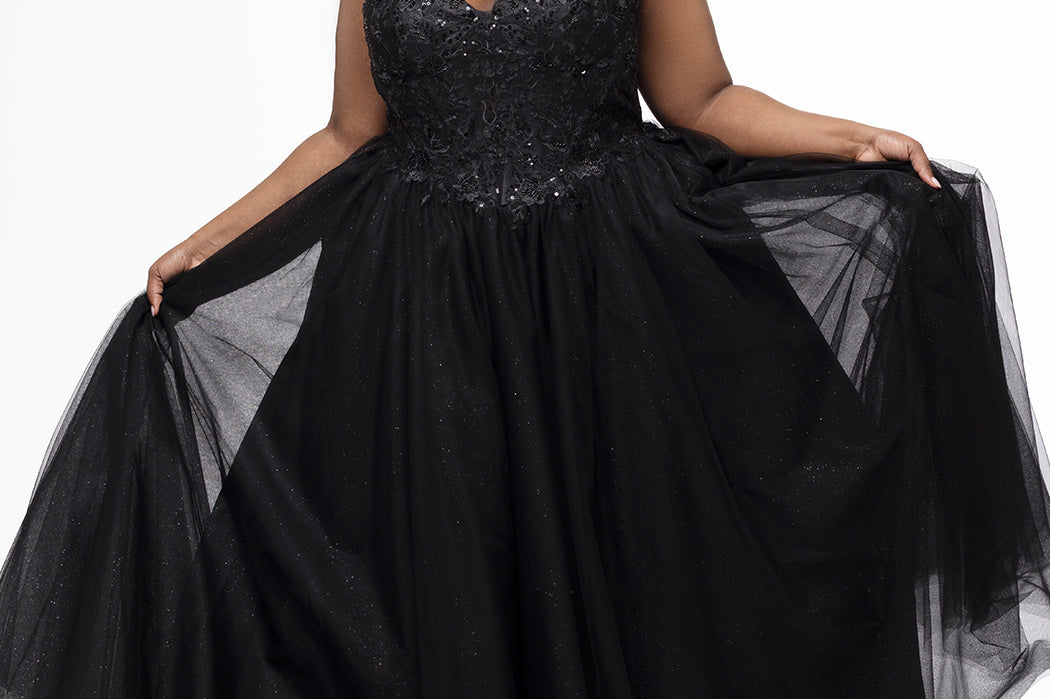 Sydney's Closet style SC7450 in black.

Ball gown silhouette, strapless bodice with deep V-mesh insert covered in lace appliques and exposed corset boning. Basque waistline and full sparkle tulle a-line skirt. Lace up back with modesty panel. 
