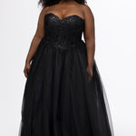 Sydney's Closet style SC7450 in black.

Ball gown silhouette, strapless bodice with deep V-mesh insert covered in lace appliques and exposed corset boning. Basque waistline and full sparkle tulle a-line skirt. Lace up back with modesty panel. 
