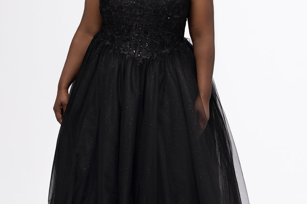 Sydney's Closet style SC7450 in black.

Ball gown silhouette, strapless bodice with deep V-mesh insert covered in lace appliques and exposed corset boning. Basque waistline and full sparkle tulle a-line skirt. Lace up back with modesty panel. 