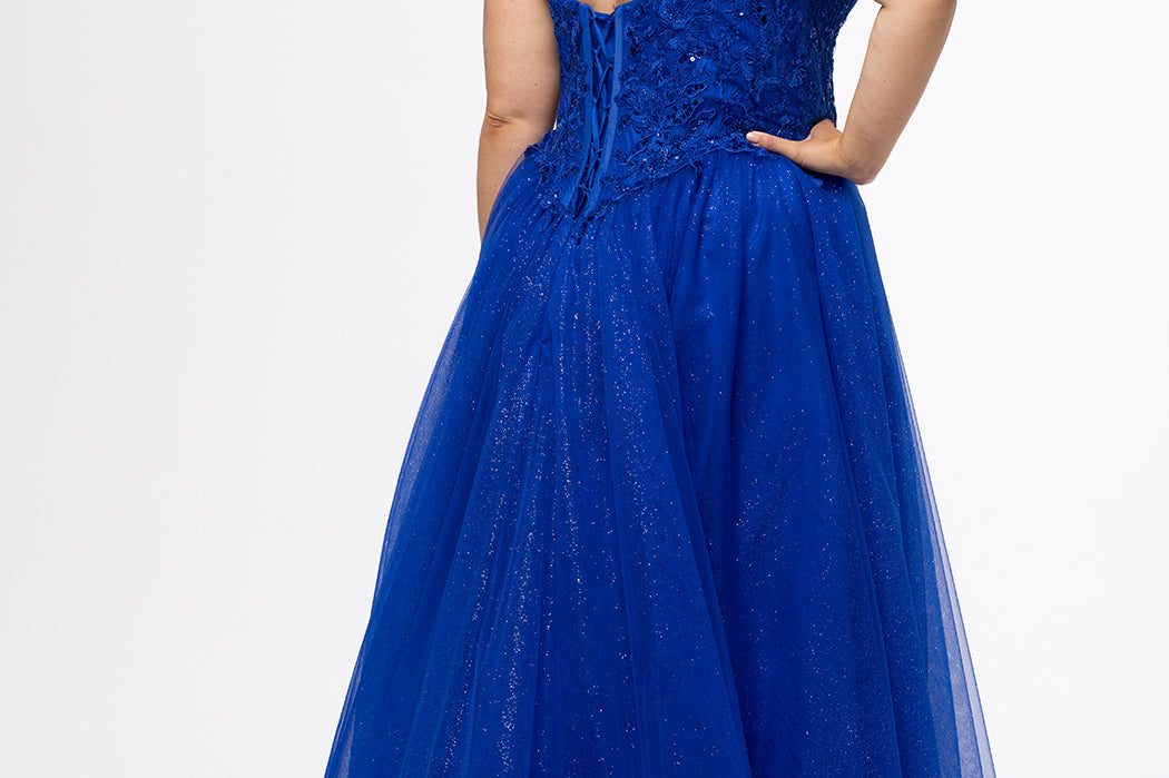Sydney's Closet style SC7450 in royal blue.

Ball gown silhouette, strapless bodice with deep V-mesh insert covered in lace appliques and exposed corset boning. Basque waistline and full sparkle tulle a-line skirt. Lace up back with modesty panel. 