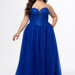 Sydney's Closet style SC7450 in royal blue.

Ball gown silhouette, strapless bodice with deep V-mesh insert covered in lace appliques and exposed corset boning. Basque waistline and full sparkle tulle a-line skirt. Lace up back with modesty panel. 