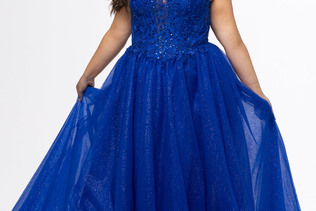 Sydney's Closet style SC7450 in royal blue.

Ball gown silhouette, strapless bodice with deep V-mesh insert covered in lace appliques and exposed corset boning. Basque waistline and full sparkle tulle a-line skirt. Lace up back with modesty panel. 