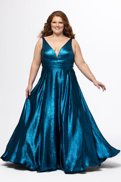 Sydney's Closet Style SC7453 in Electric Blue

Plus Size A-line prom dress in metallic shimmer knit fabric, V-neckline with nude mesh insert, bra-friendly straps, pleated bodice, natural waisltine, A-line skirt with box pleats, pockets and a horsehair hem.