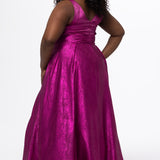 Sydney's Closet Style SC7453 in Magenta Pink

Plus Size A-line prom dress in metallic shimmer knit fabric, V-neckline with nude mesh insert, bra-friendly straps, pleated bodice, natural waisltine, A-line skirt with box pleats, pockets and a horsehair hem.
