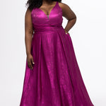 Sydney's Closet Style SC7453 in Magenta Pink

Plus Size A-line prom dress in metallic shimmer knit fabric, V-neckline with nude mesh insert, bra-friendly straps, pleated bodice, natural waisltine, A-line skirt with box pleats, pockets and a horsehair hem.