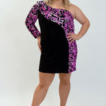 This is SC8114 in our Sydney's Closet Homecoming collection. This plus size party dress comes in pink and multi! This dress has a one shoulder bodice with one long sleeve. This fitted light stretch velvet dress has reversible flip sequins on the sleeve and neckline. This gown is going to be a sensation for this homecoming season!