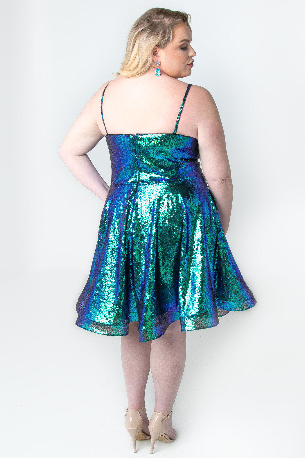 This is SC8122 in our Sydney's Closet Homecoming collection. This plus size party dress comes in white, red, blue, light blue, green, and purple! This dress has straps covered in sequins, a scoop neckline, and a natural waistline. This a-line all over sequins dress has a horsehair hem so that you can dance the night away! To make it even more spectacular, we have added pockets to make this the perfect dress for homecoming season!