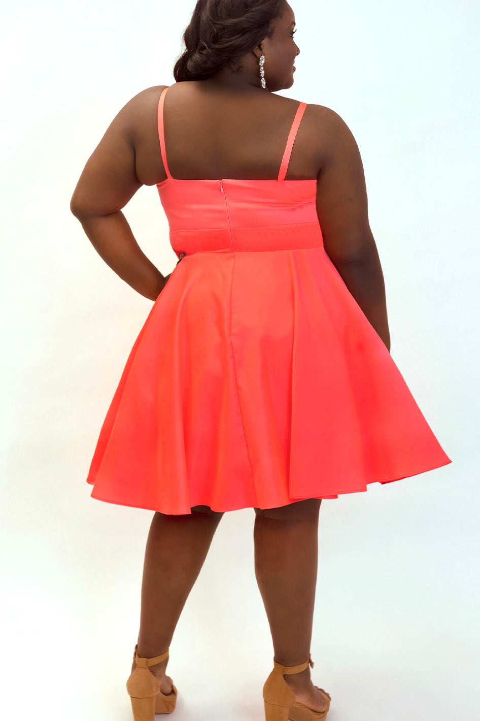This is SC8126 in our Sydney's Closet Homecoming collection. This plus size party dress comes in blue and coral! This dress has spaghetti straps and a v-neckline with a mesh insert to match the color of the dress! This a-line satin gown flows beautifully with your dance moves! To make this gown perfect, we have added pockets which is why you need it for this homecoming season!