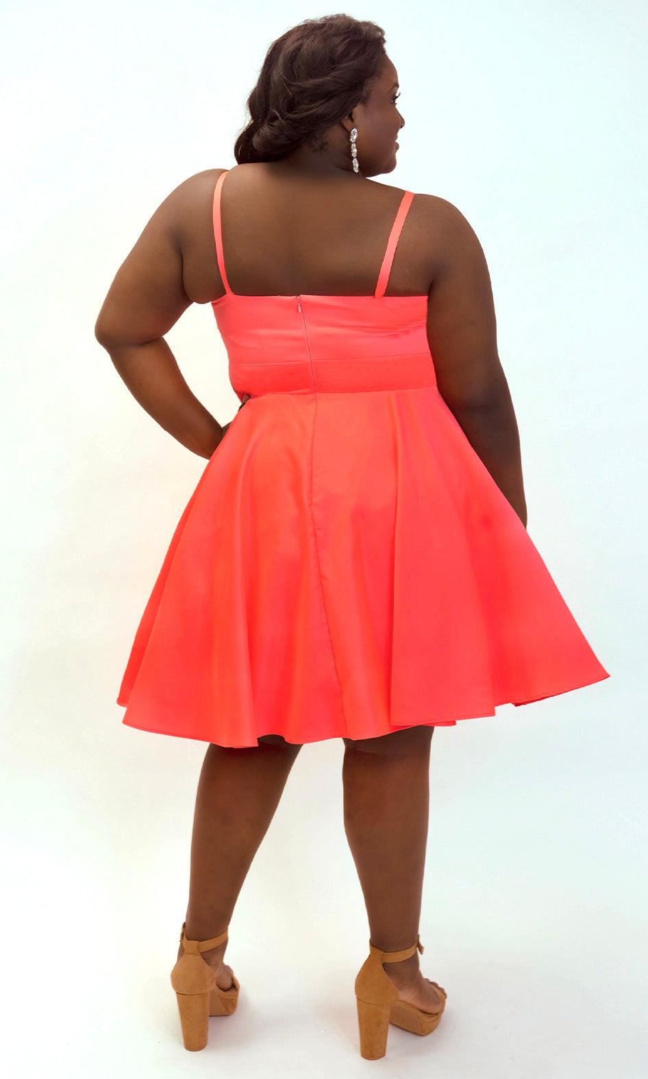 This is SC8126 in our Sydney's Closet Homecoming collection. This plus size party dress comes in blue and coral! This dress has spaghetti straps and a v-neckline with a mesh insert to match the color of the dress! This a-line satin gown flows beautifully with your dance moves! To make this gown perfect, we have added pockets which is why you need it for this homecoming season!