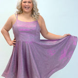 This is SC8130 in our Sydney's Closet Homecoming collection. This plus size party dress comes in purple, green, and blue! This dress has spaghetti straps, a scoop neckline, and a natural waistline. This a-line shimmer knit dress has a horsehair hem to make dancing a breeze! This gown has pockets which makes it perfect for this homecoming season!