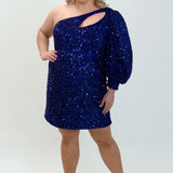 This is SC8133 in our Sydney's Closet Homecoming collection. This plus size party dress comes in black, blue, purple, and red! This dress has a one shoulder long sleeve pouf sleeve, a cutout bodice, and a natural waistline. This fitted all over sequin dress has the spotlight as the most perfect dress for this homecoming season!