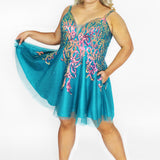 This is SC8134 in our Sydney's Closet Homecoming collection. This plus size party dress comes in blue, pink, and light blue! This dress has straps covered in sequins and a v-neckline with mesh to match the gown. This a-line dress has sequin on top of the glitter tulle and a satin lining! This gown will bring on the sparkle which makes it the most perfect for this homecoming season!