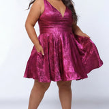 Plus-size model wearing a sleeveless a-line mini dress in a vibrant metallic fuchsia pink knit fabric. The dress features a deep V-neckline, fitted waistband, and a full flared skirt with subtle pleating. She is styled with long wavy dark brown hair, hoop earrings, and nude platform ankle-strap heels, posing against a light gray studio background while showing off the pockets in the skirt.

Sydney's Closet SC8175 in magenta