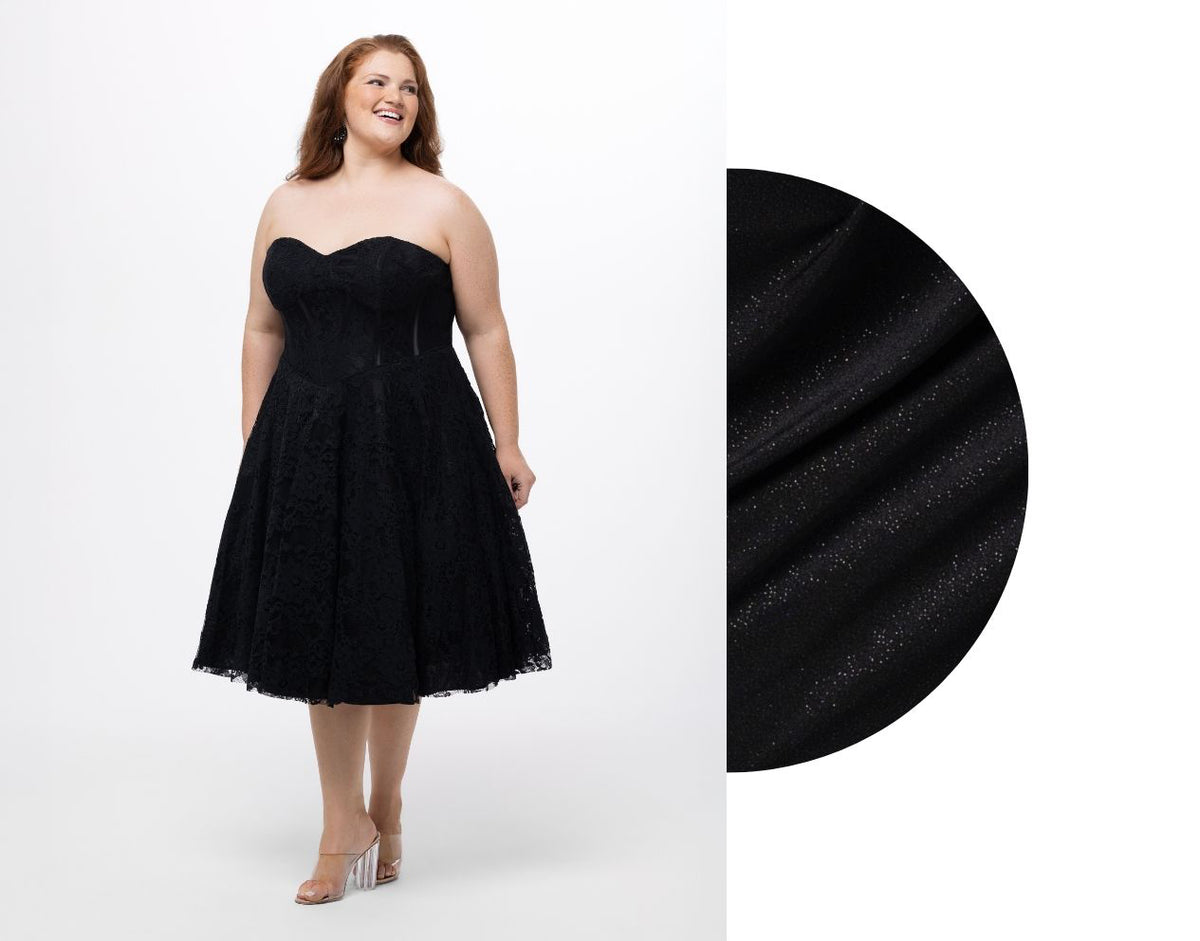 Woman wearing a black strapless dress with close-up of fabric texture on a white background