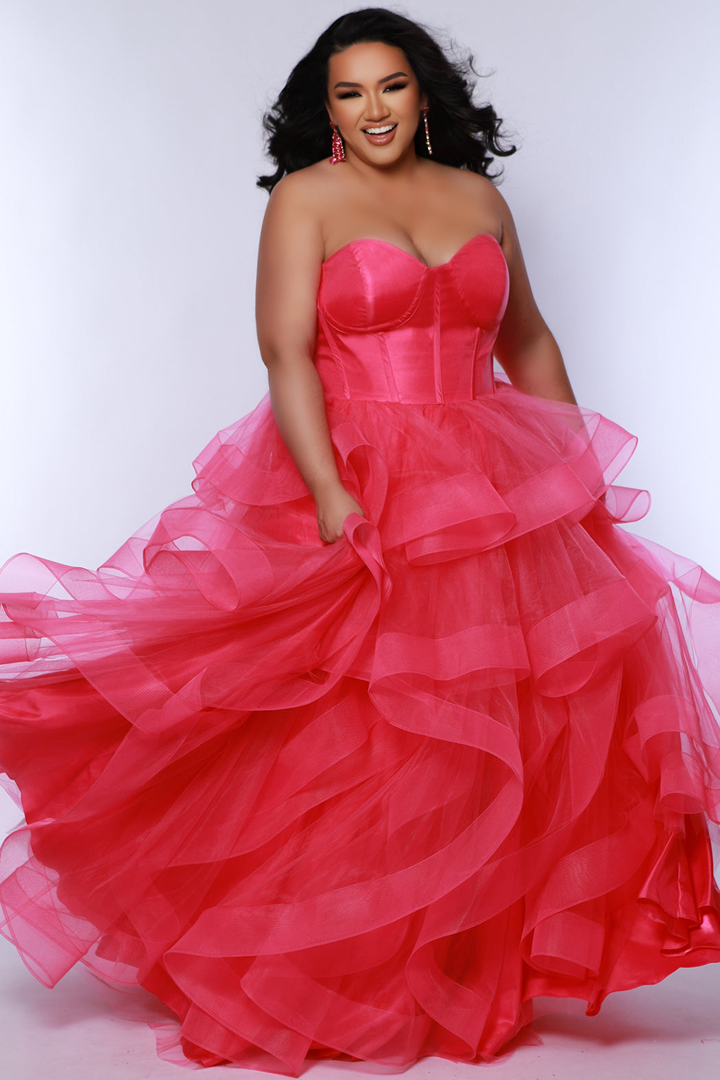 Tease prom TE2420 Pink. Tulle ruffles on a tiered skirt, exposed boning on bodice, strapless, ballgown.