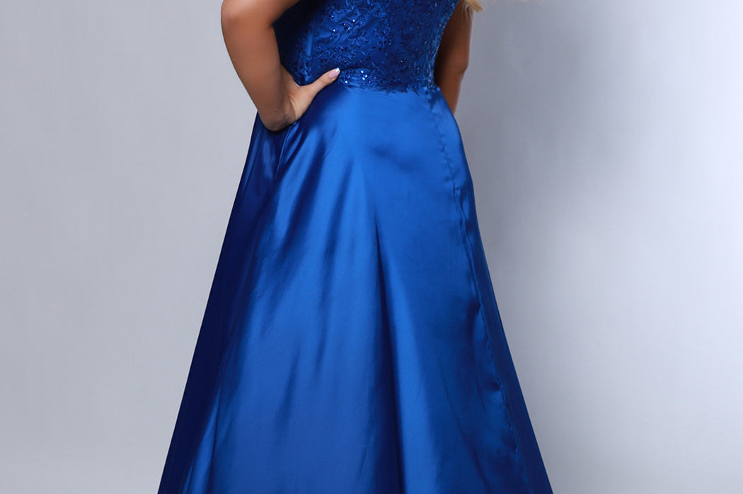 Best selling Tease Prom TE2437 plus size, A-line prom dress with double spaghetti straps, V-neckline, lace bodice and satin skirt with pockets and slit. Available in purple, blue, black, red, or green. 