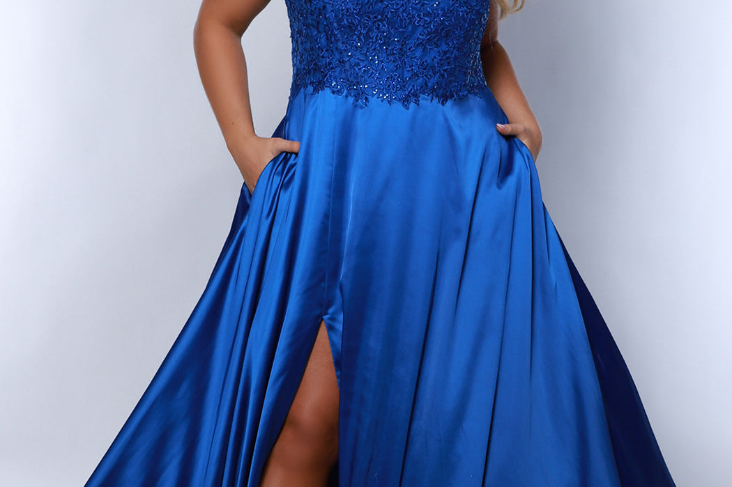 Best selling Tease Prom TE2437 plus size, A-line prom dress with double spaghetti straps, V-neckline, lace bodice and satin skirt with pockets and slit. Available in purple, blue, black, red, or green. 