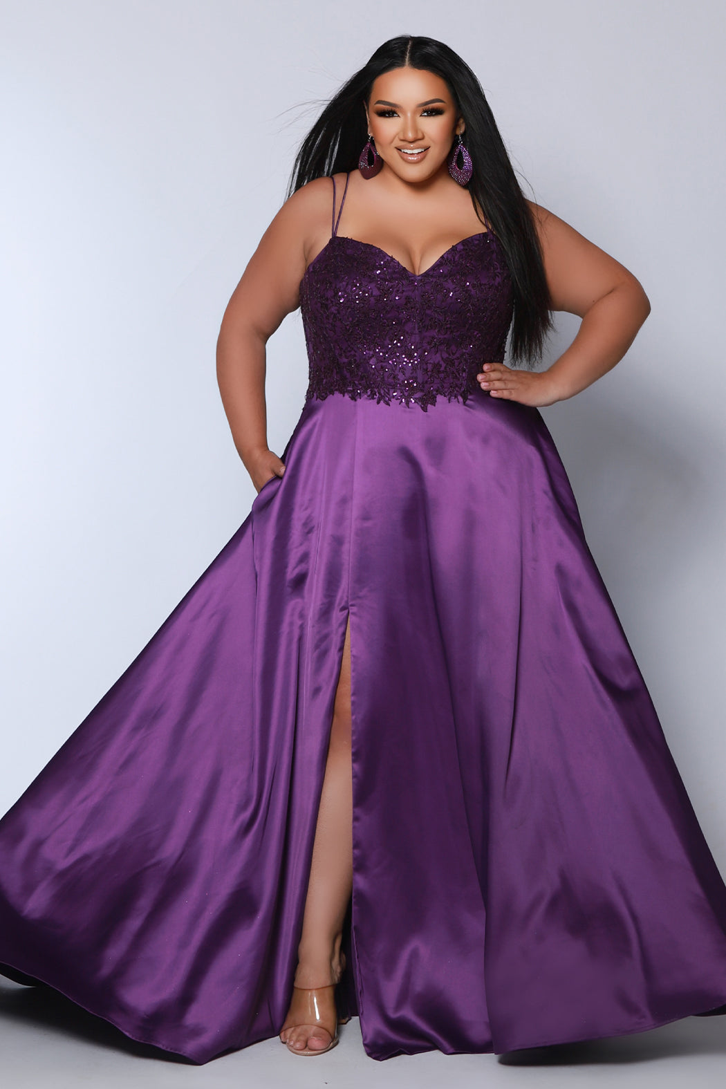Best selling Tease Prom TE2437 plus size, A-line prom dress with double spaghetti straps, V-neckline, lace bodice and satin skirt with pockets and slit. Available in purple, blue, black, red, or green. 