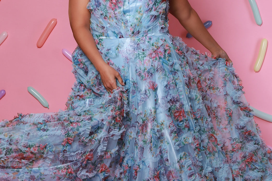 Plus size 3D floral print A-line prom dress.  V-neckline with spaghetti straps, mesh insert and pleated bodice. A-line skirt with pockets. Availablit in light blue, hot pink, royal blue and lilac in sizes 14-32. Style TE2508 from Tease Prom.