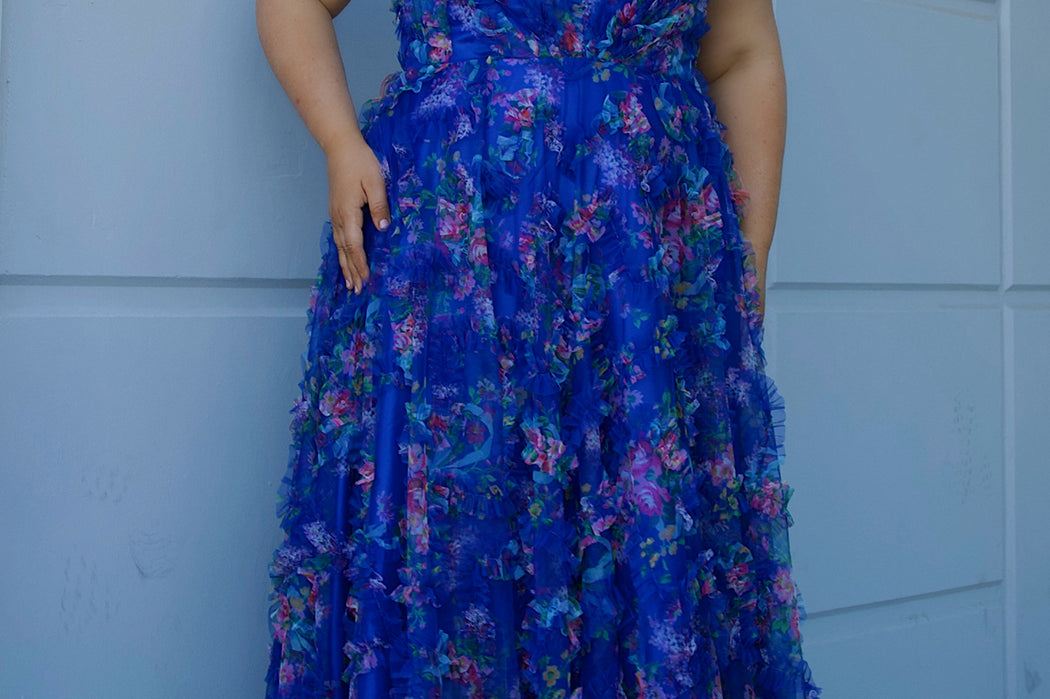 Plus size 3D floral print A-line prom dress.  V-neckline with spaghetti straps, mesh insert and pleated bodice. A-line skirt with pockets. Availablit in light blue, hot pink, royal blue and lilac in sizes 14-32. Style TE2508 from Tease Prom.