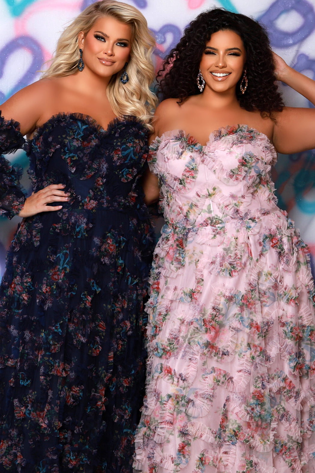 Tease Prom style TE2509 in blush pink or navy blue. Strapless, sweetheart neckline with pleated 3D floral tulle. A-line skirt with pockets and slit. Detachable puff sleeves with cuff included. Lace-up back for an easy fit. 