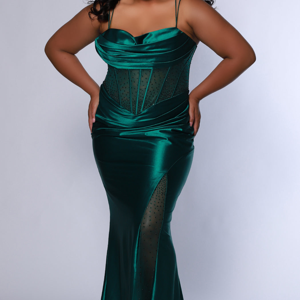 Sexy plus size fitted prom dress with double spaghetti straps, pleated bodice with optional bodice lining.  Exposed boning with hot fix stones on basque waistline.  Slim fitted skirt with ruching. High slit filled in with mesh and hot fix stones. Tease Prom style TE2516 avialable in berry, forest and navy. 