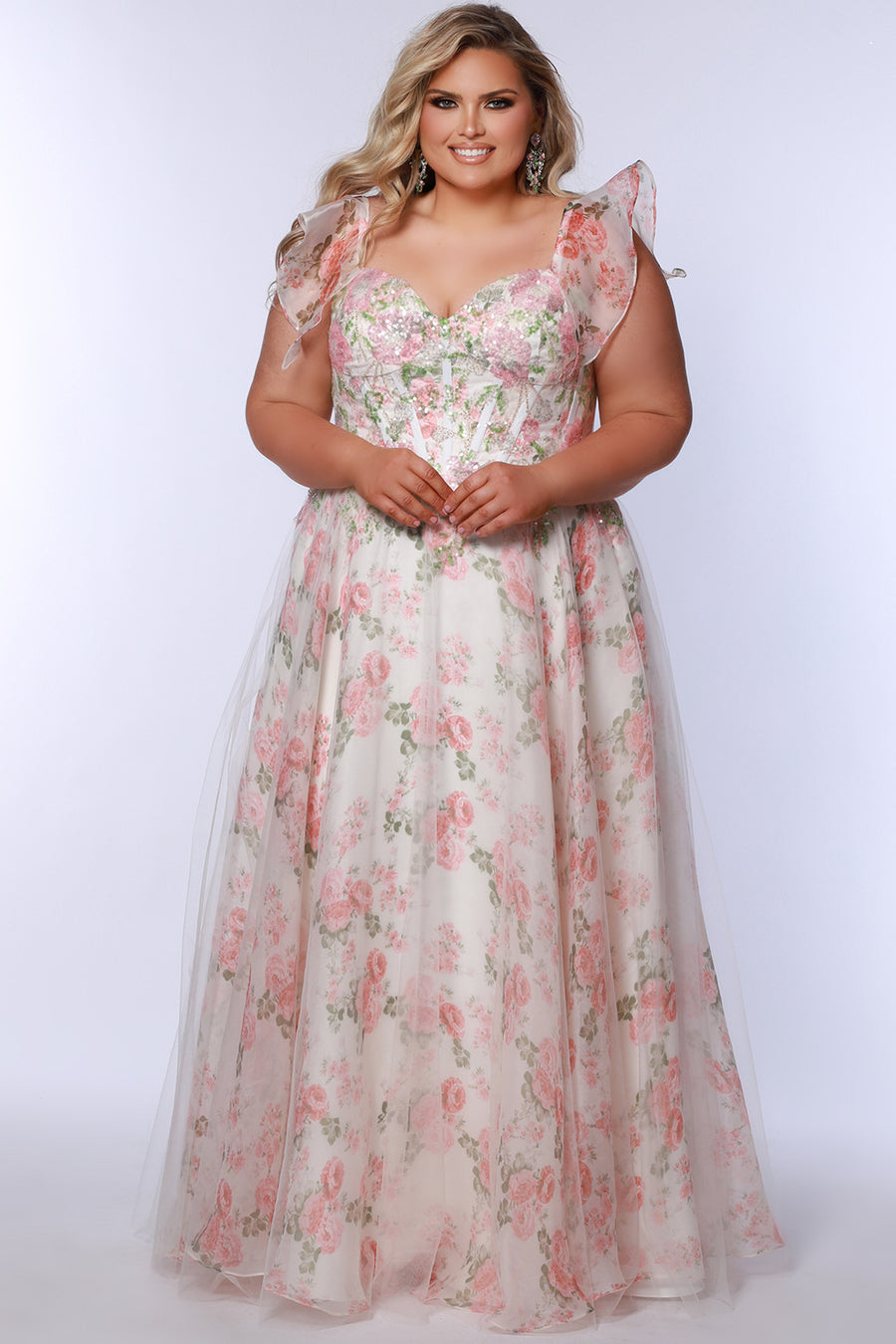 Tease Prom style TE2527 plus size floral prom dress. Printed floral organza with sequin floral leaf appliques.  Spaghetti straps with drape flutter sleeve. Exposed corset boning on bodice. A-line skirt with long invisible center back zipper.