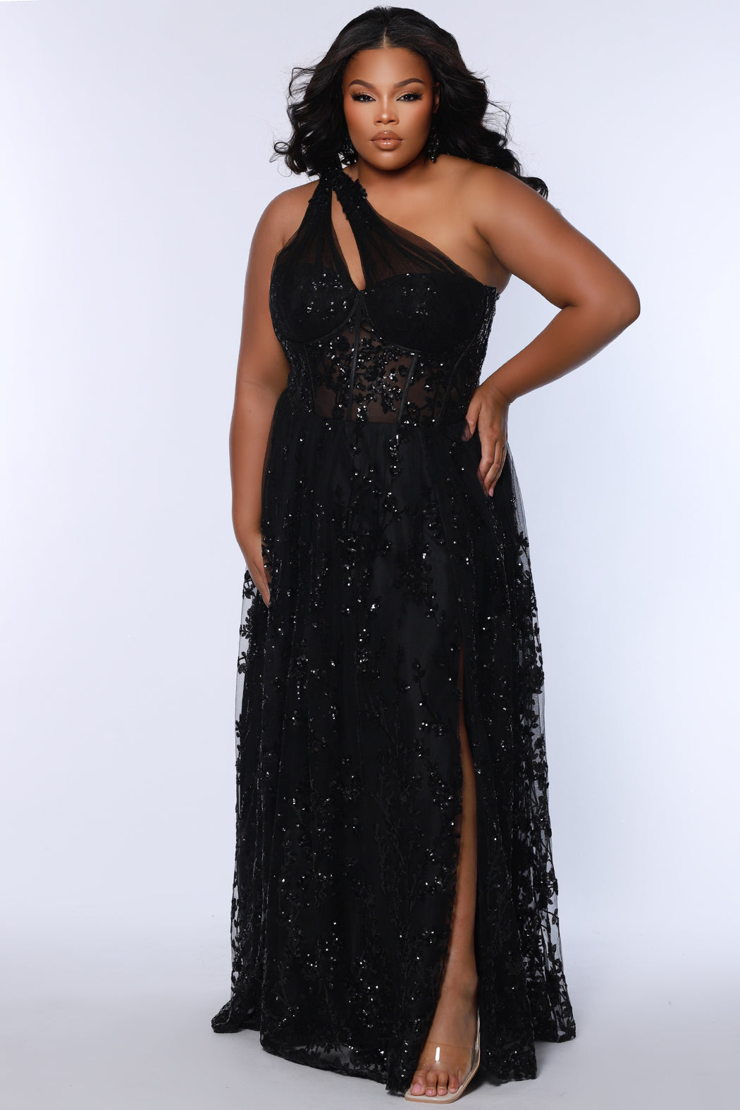 Plus size prom ball gown with glitter lace and tulle. Style TE2529 by Tease Prom is avialable in burgundy red, forest green or onyx black in sizes 14-32.  One shoulder with illusion cut out on sweetheart bodice with exposerd corset boning. 