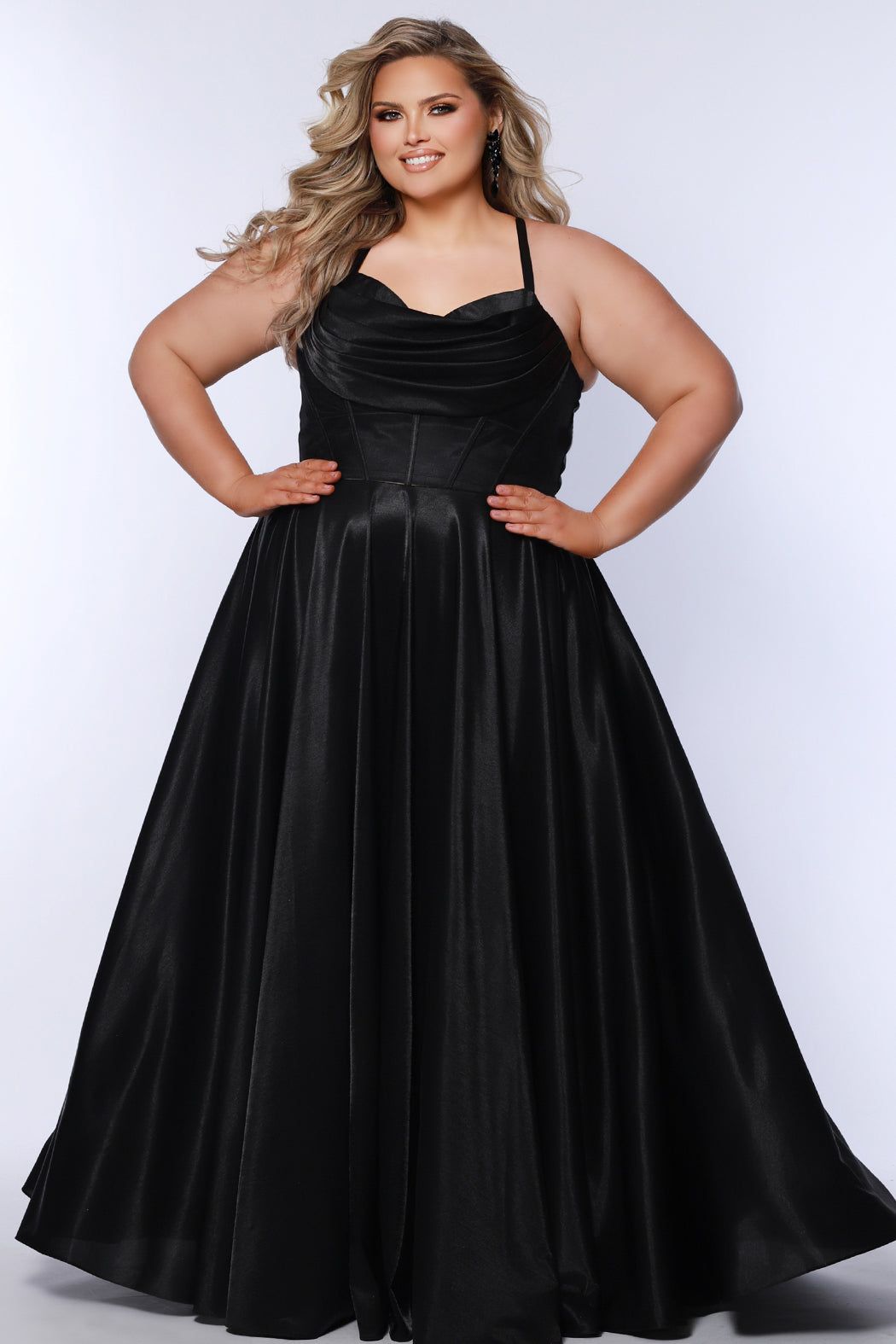 Tease Prom style TE2532 is available in black, blue, pink, purple or red in plus sizes 14-32.  Pleated draped bodice with exposed boning and optional bodice lining. Full A-line skirt with pockets. Straps go into lace up ties with modesty panel on the back. 